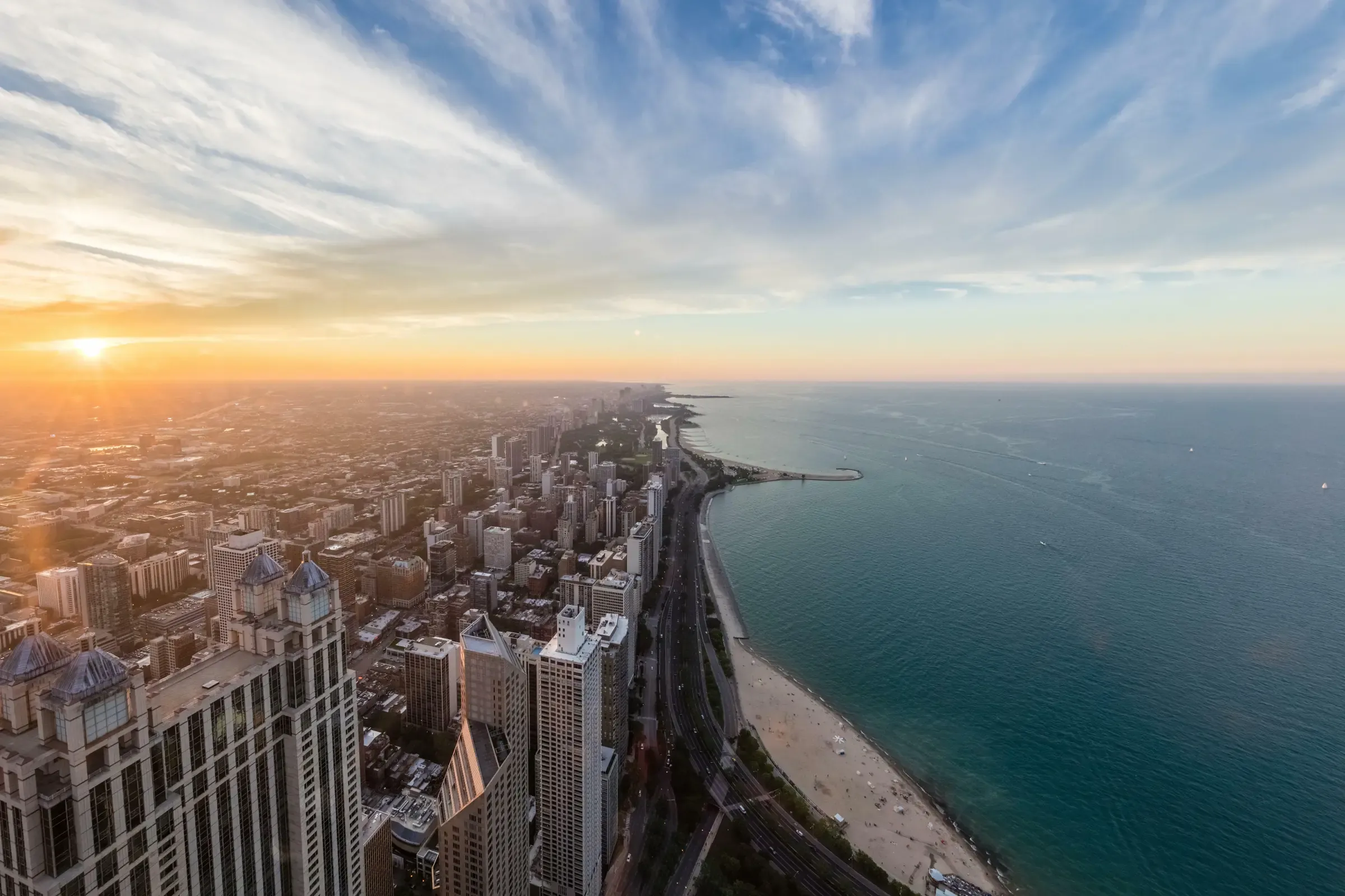 Chicago's lakefront and the Lake Michigan shoreline from above at sunset