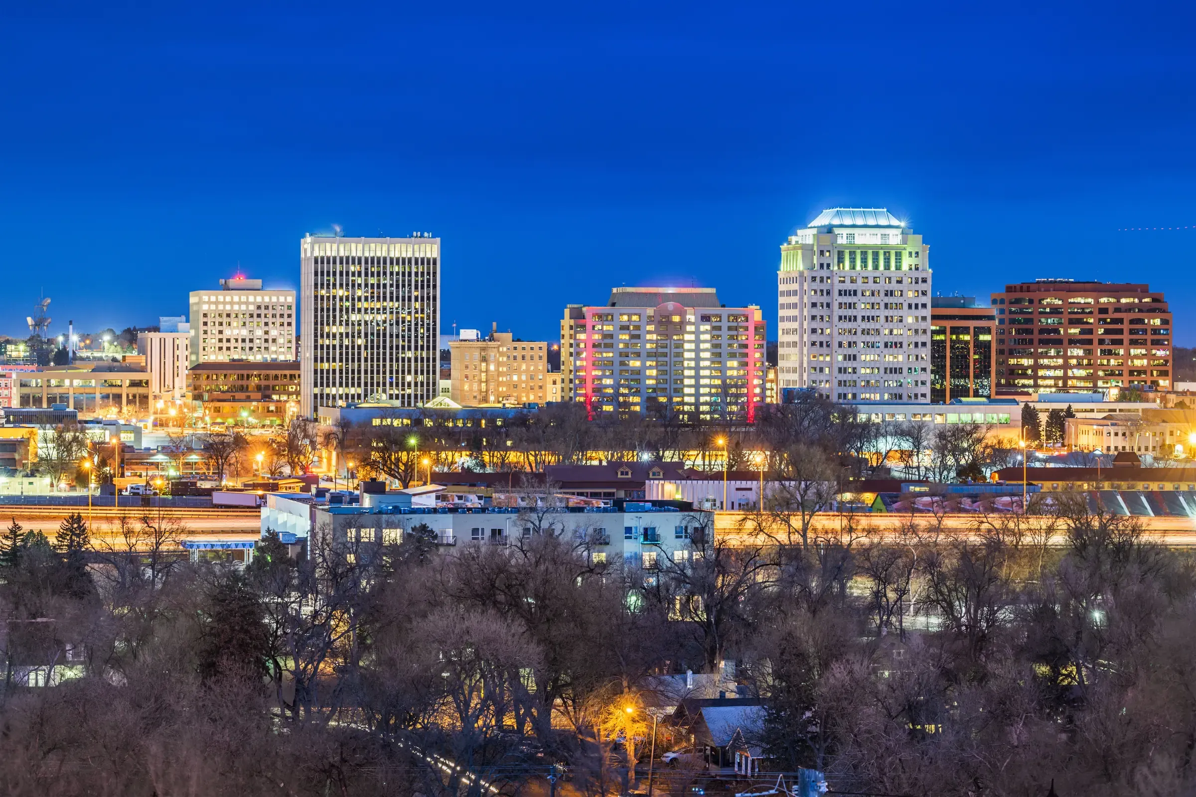 Downtown Colorado Springs lit up at dusk