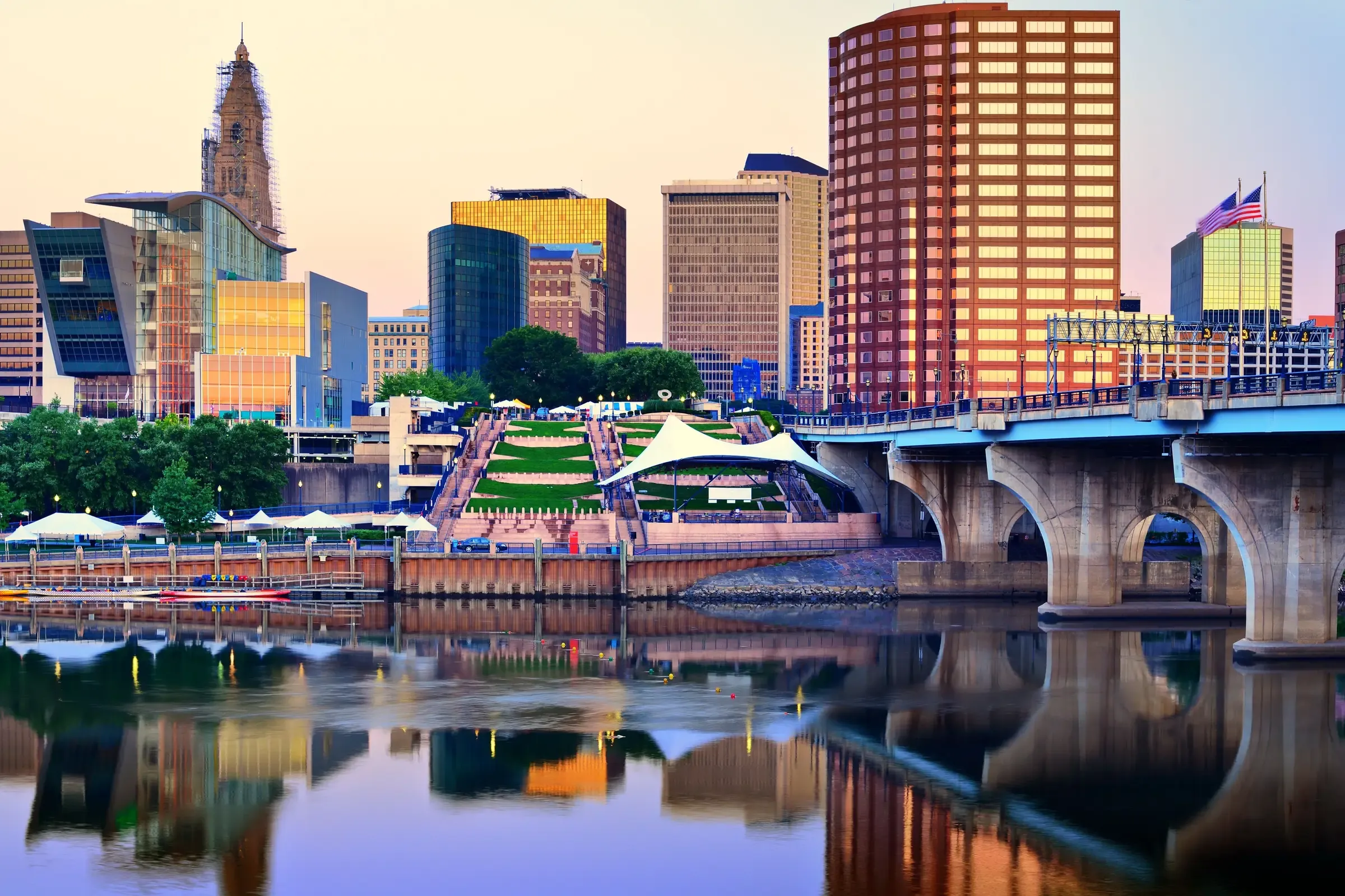 Downtown Hartford and its riverfront reflected in the Connecticut River at dusk