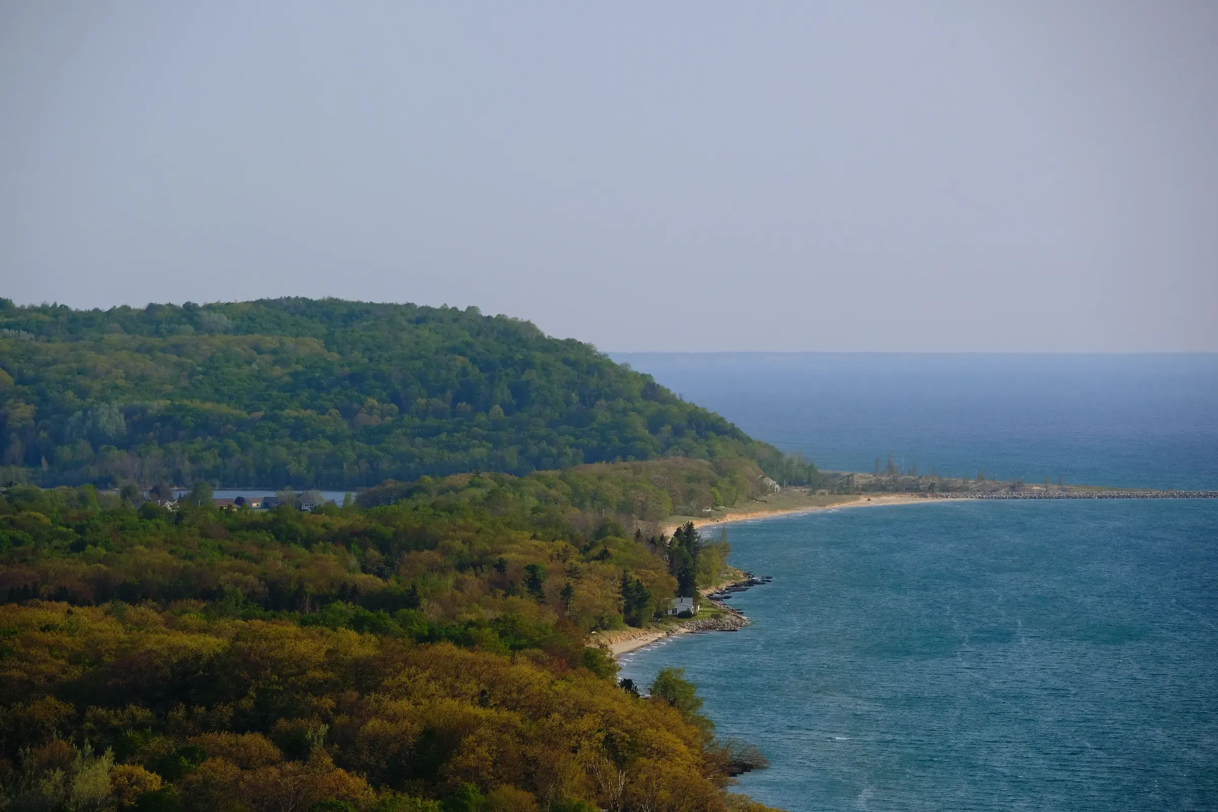 Wooded bluffs above the Lake Michigan shoreline
