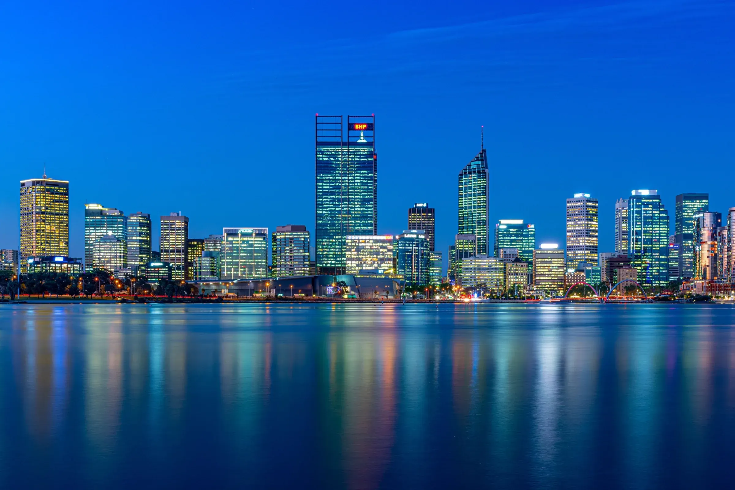 The Perth skyline reflected in the Swan River at night